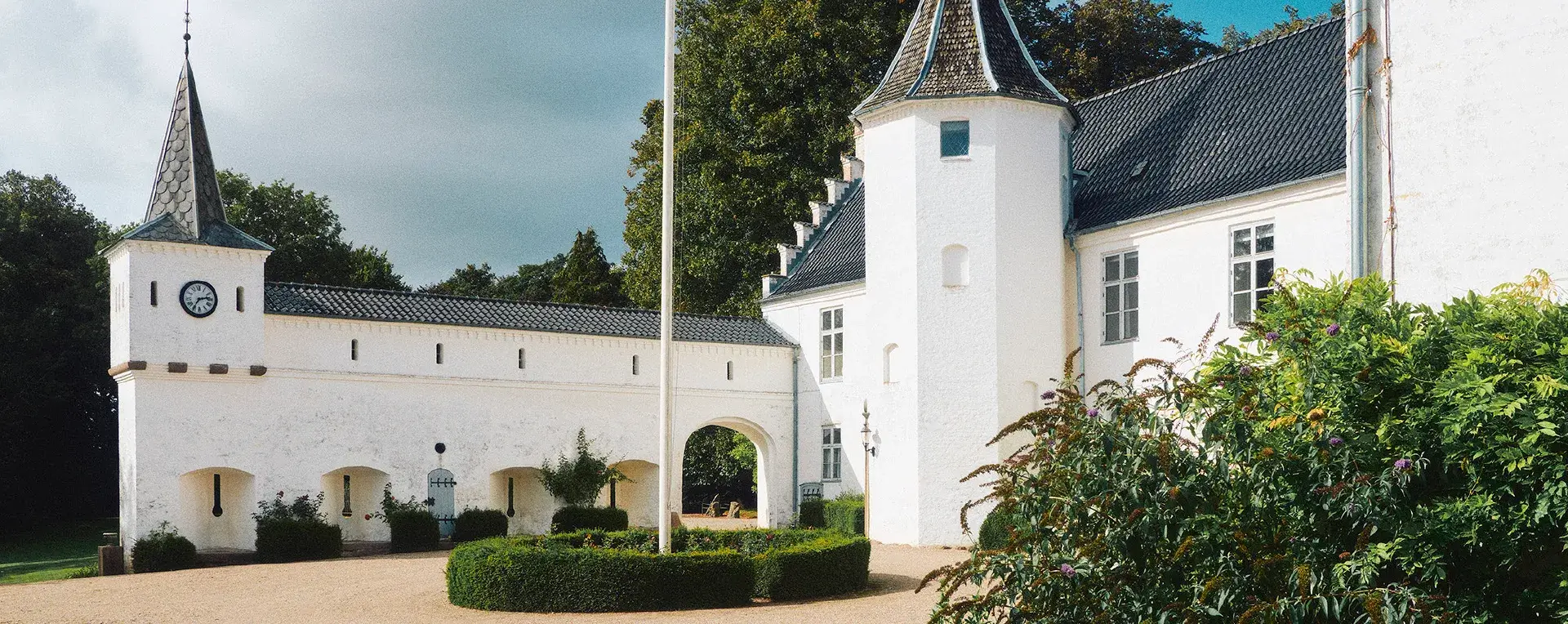 White castle tower and courtyard at Dallund Castle, Denmark